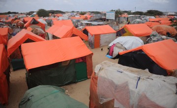 Makeshift houses in an IDP camp in Somalia. They are made up of old clothes and sacks reinforced by sticks with plastic sheets on top to avoid rains. Photo: Mohamed Abdiwahab / Concern Worldwide