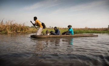 Nile Hope staff travel through the swamps by canoe. Sometimes it can take two days to reach a remote destination. Photo: Kieran McConville / Concern Worldwide