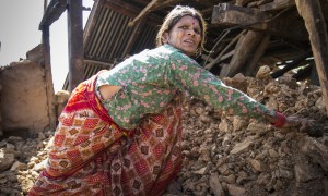 Tulasa Aryal, 58, tries to salvage what she can from her earthquake-ravaged home in Bakrang, a village near the epicenter of the earthquake. A roughly hour drive from Gorkha, Bakrang was among the hardest hit villages in the 7.8-magnitude earthquake that hit Nepal on April 25, 2015. Out of 793 houses homes in Bakrang, 515 were completely destroyed. Photo: Crystal Wells/Concern Worldwide