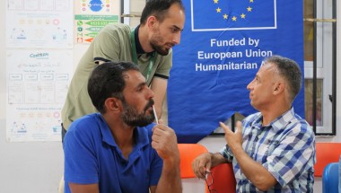 Committee member Azzam* (right) participates in an information session as part of the Protection programme at Haliliye Community Centre. Photo: Eugene Ikua/Concern Worldwide