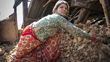 Tulasa Aryal, 58, tries to salvage what she can from her earthquake-ravaged home in Bakrang, a village near the epicenter of the earthquake. A roughly hour drive from Gorkha, Bakrang was among the hardest hit villages in the 7.8-magnitude earthquake that hit Nepal on April 25, 2015. Out of 793 houses homes in Bakrang, 515 were completely destroyed. Photo: Crystal Wells/Concern Worldwide