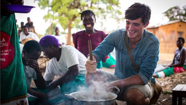 Food writer, photographer and TV presenter Donal Skehan with &#039;lead mothers&#039; who are trained by Concern Wolrdwide on nutrition and teach women in the Kachere Care Group about how to make a nutritious meal for their families with five major food groups. Location: Kaigwanga Village, Mchinji, Malawi. Photo: Jennifer Nolan / Concern Worldwide.