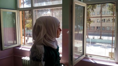 Hasna looks from her classroom window during a break from her studies in a Temporary Education Centre for Syrian refugees in Turkey. Photo: Concern Worldwide.