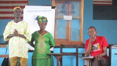 William Zoe, Martha Waaloe, community change makers and Harry Johnson, Concern staff member, at an engaging men and women in equality workshop, Liberia, 2013. Photo: Bernadette Crawford/ Concern Worldwide.