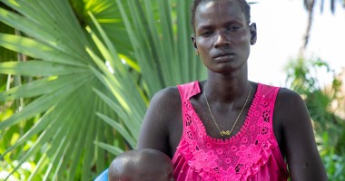 Maria with her son, Goi (2), outside their home in Leer County, Unity State, South Sudan. Photo: Eugene Ikua/Concern Worldwide 