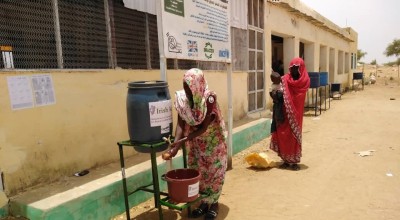To help reduce the spread of Covid-19 beneficiaries wash hands before entering Concern supported Nutrition Facility in West Darfur.
