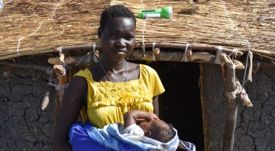 Nyaphan holding her now two-month-old baby Nyaguande