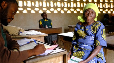 Christine awaits voucher for cash assistance in DRC 