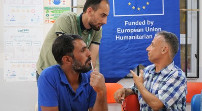 Committee member Azzam* (right) participates in an information session as part of the Protection programme at Haliliye Community Centre. Photo: Eugene Ikua/Concern Worldwide
