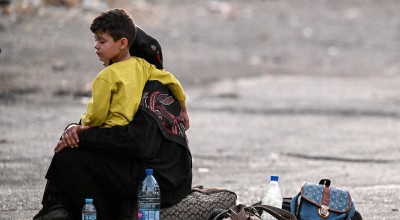 A boy and his mother after leaving Lebanon
