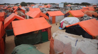 Makeshift houses in an IDP camp in Somalia. They are made up of old clothes and sacks reinforced by sticks with plastic sheets on top to avoid rains. Photo: Mohamed Abdiwahab / Concern Worldwide