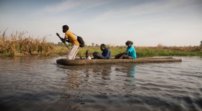 Nile Hope staff travel through the swamps by canoe. Sometimes it can take two days to reach a remote destination. Photo: Kieran McConville / Concern Worldwide
