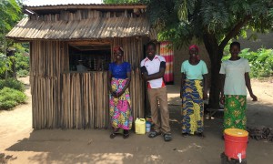 Graduation beneficiaries in front of the shop they have set up under the project; they have taken the initiative to establish a hand-washing station in front of the shop and they report soap sales have increased in the last few days as communities have been sensitised on the importance of hand-washing to prevent COVID transmission. Burundi Photo: Maud Biton / Concern Worldwide