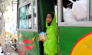 Sakuma* sells sweets and chocolates on crowded buses in Dhaka to save money for her brother's education. Sakuma* (14) and her brother Kassim* are supported by a Concern run pavement dweller center, Ananda Bazar, Dhaka. Having lived on the street most of her life, she lost her mother to illness and her father was a drug addict when a worker from the pavement dweller center found her. They both now live in the pavement dweller center and receive a host of supports from Concern including shelter, food, educati