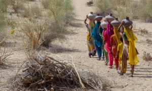 Community women carrying water in mud pots from the communal well in Pakistan, 2007. Photo: Sharjeel Arif/Black Box Sounds.