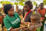 Hella has brought Nyanga to a Concern outreach clinic so that he can receive the supplements that will treat his severe malnutrition.