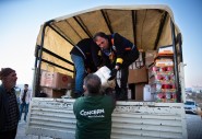Concern staff unloading truck of supplies in Turkiye
