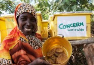 Hadija, from the Yalatiff women group showcases part of the honey harvested by her group in Handaraku